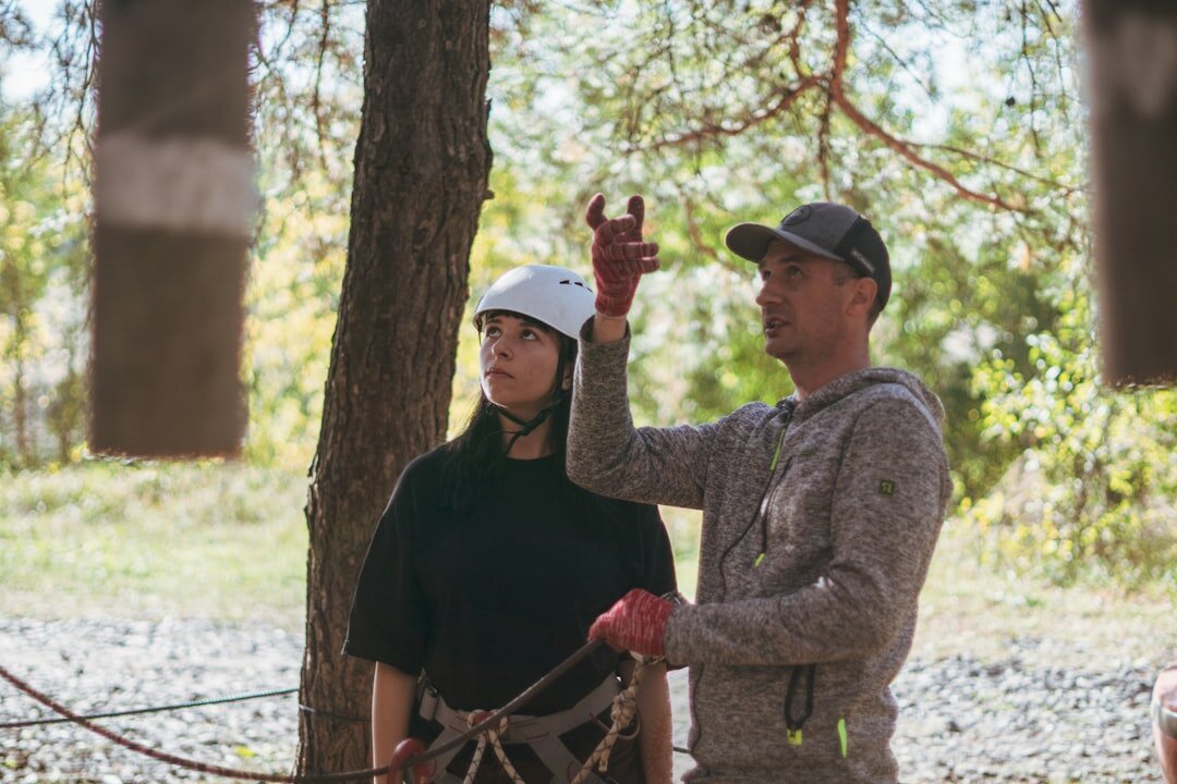 Employees crossing an outdoor obstacle course together